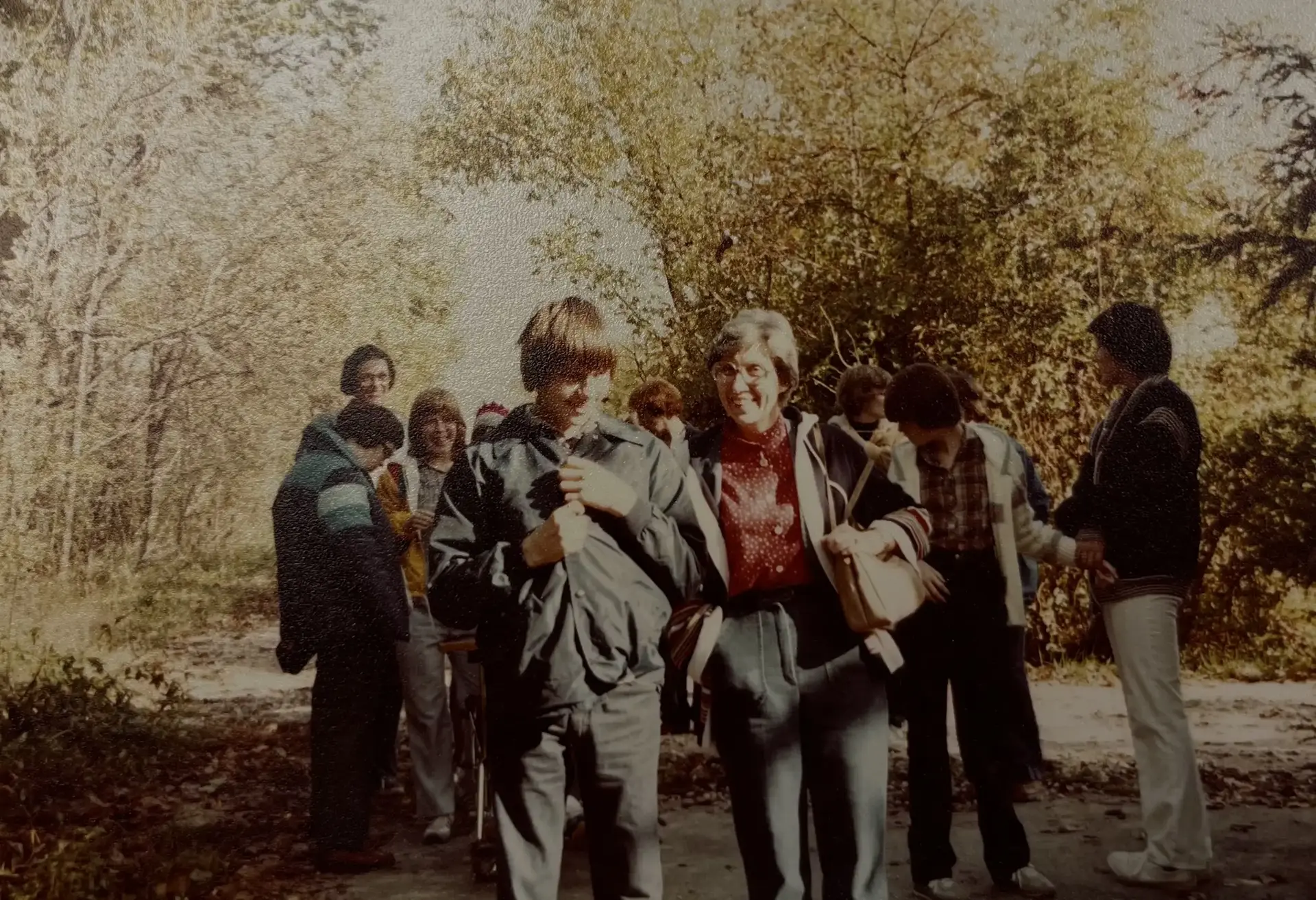 A vintage photograph of Elizabeth Richardson walking with ERC clients
